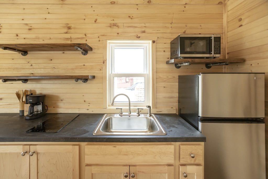 a modern kitchen inside of a cabin