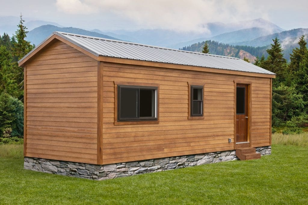 a prefabricated cabin with brown siding